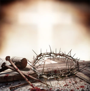Crown of thorns with cross behind.