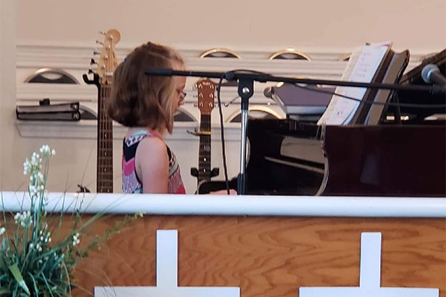 Kaylee playing piano.